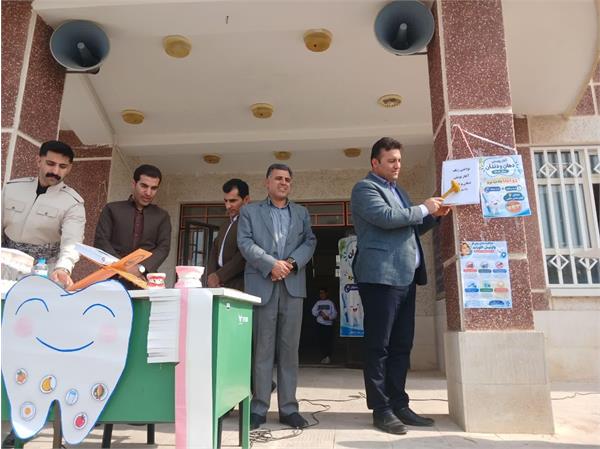 نواختن زنگ آغاز پویش ملی سلامت دهان و دندان در شهرستان ثلاث باباجانی